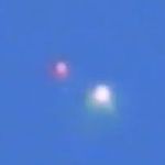White and red UFOs captured over Mexico City on January 10, 2013